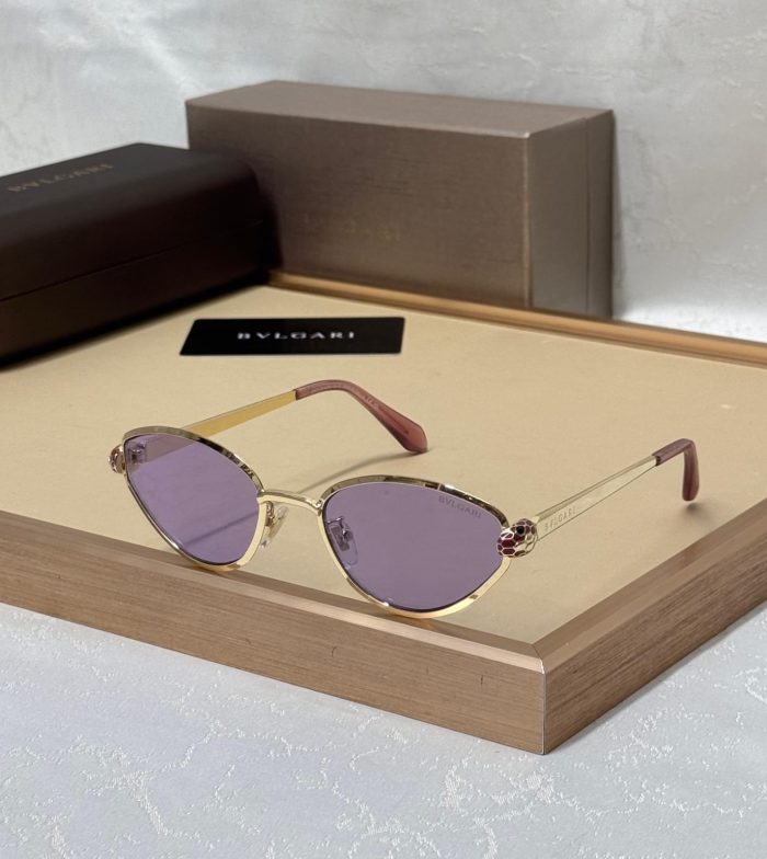 Bvlgari Cat-Eye Sunglasses With Gold-Tone Metal Frames And Lilac/Pink Lenses.