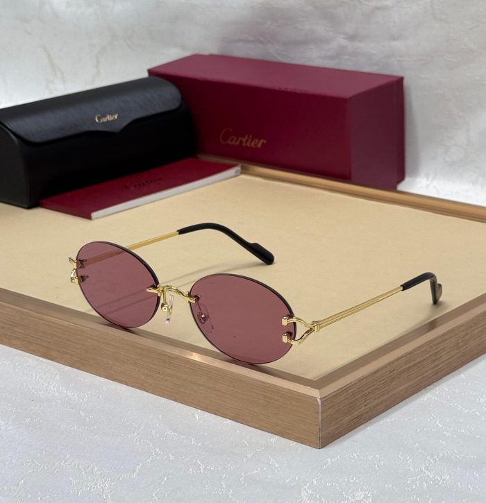 Cartier CT0551S Signature C de Cartier Oval Sunglasses With Gold-Finish Metal Frames And Pink Lenses