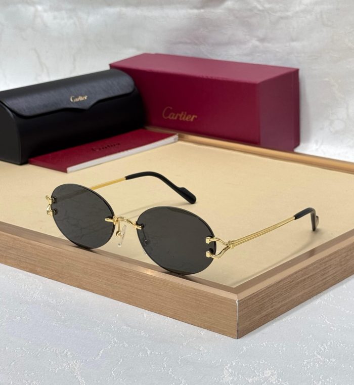 Cartier CT0551S Signature C de Cartier Oval Sunglasses With Gold-Finish Metal Frames And Black Lenses