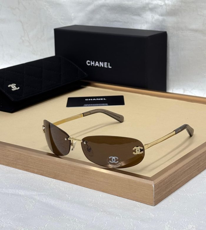 Chanel Gold And Brown Rimless Sunglasses With A Crystal CC Logo
