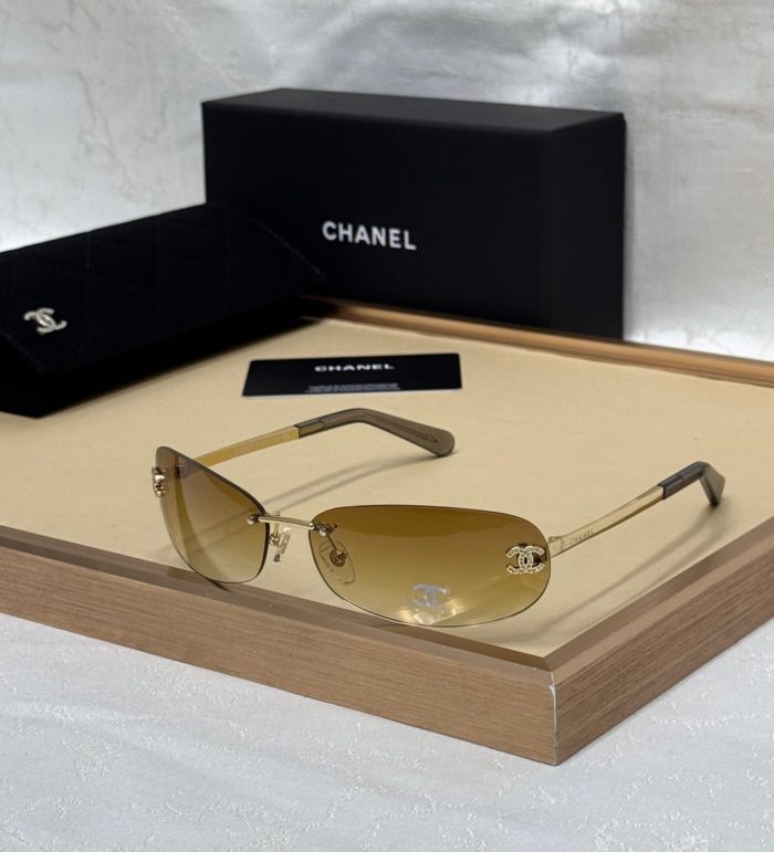Chanel Gold And Yellow lens Rimless Sunglasses With A Crystal CC Logo