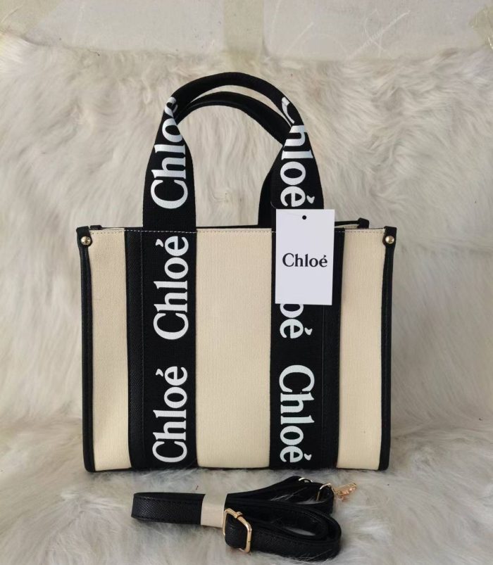 Chloé Small Woody tote bag in natural linen canvas with brown shiny calfskin trim and logo ribbon handles