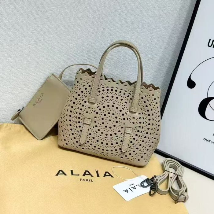 Alaïa Mina 20 laser-cut leather tote bag in a beige  color