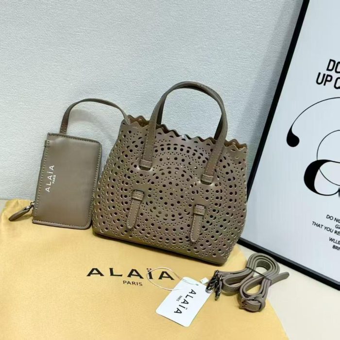 Alaïa Mina 20 laser-cut leather tote bag in a grey  color
