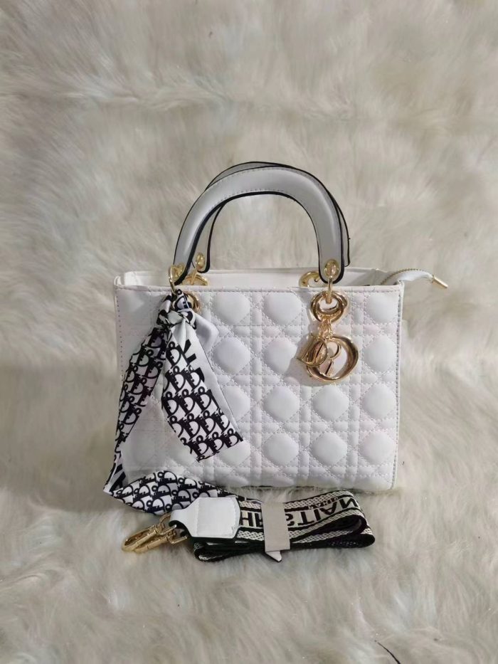 Dior Lady Dior bag in a White color with cannage quilting and gold-finish metal D.I.O.R. charms