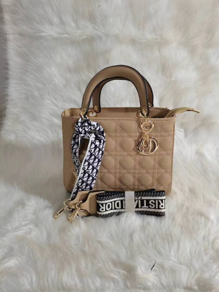 Dior Lady Dior bag in a Beige Calfskin color with cannage quilting and gold-finish metal D.I.O.R. charms