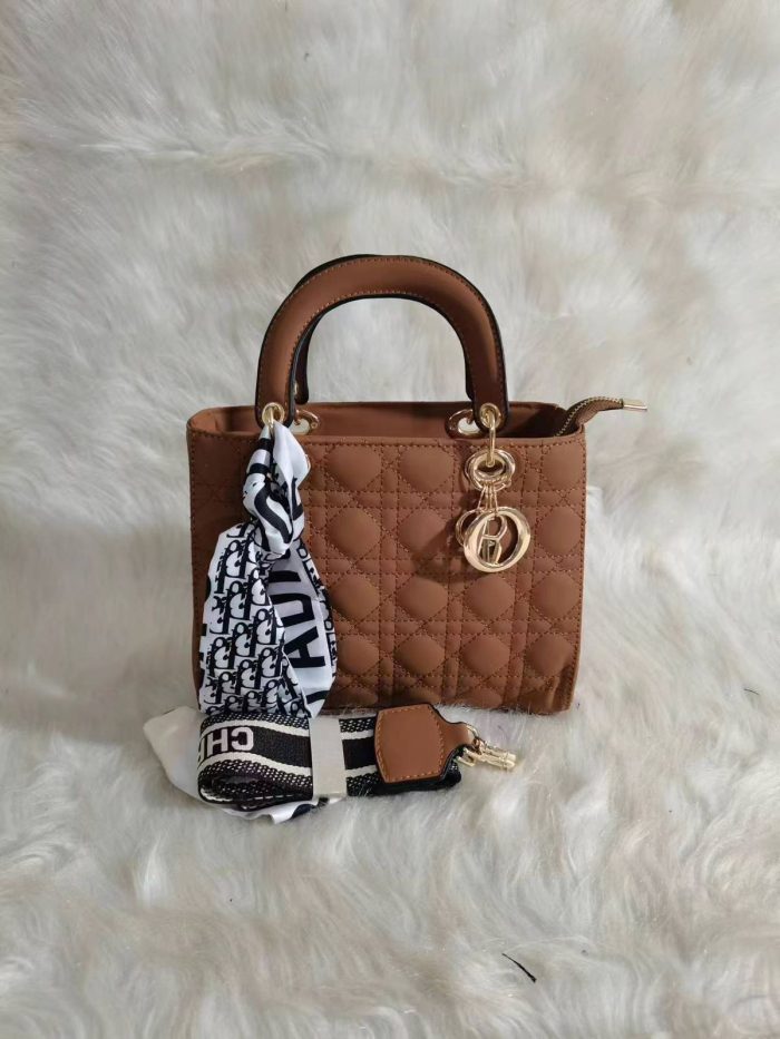 Dior Lady Dior bag in a Brown color with cannage quilting and gold-finish metal D.I.O.R. charms