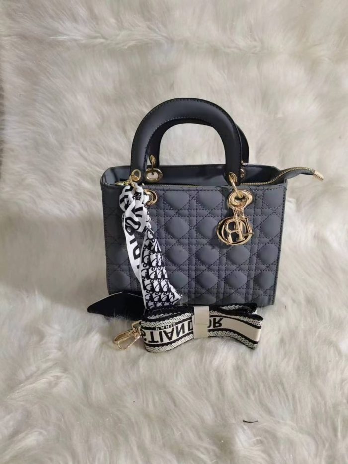 Dior Lady Dior bag in a Grey  color with cannage quilting and gold-finish metal D.I.O.R. charms