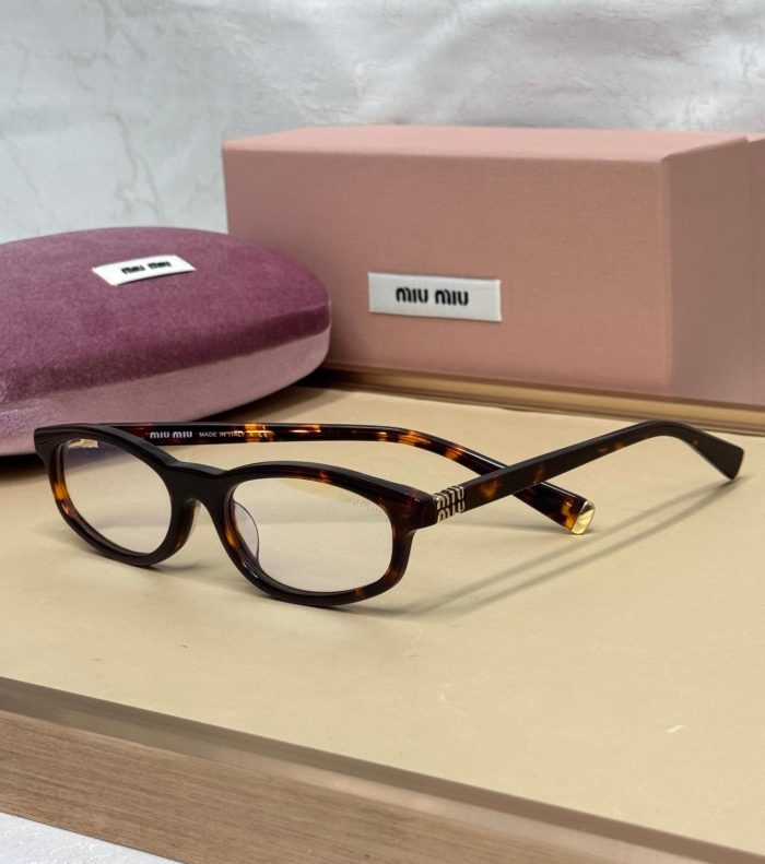 Miu Miu MU A06S Pair Of Eyeglasses In A Brown/Havana Color