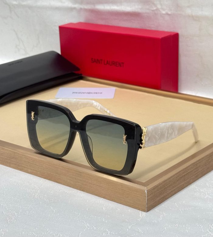 Saint Laurent Sunglasses With A Black Frame And Yellow-To-Green Gradient Lenses