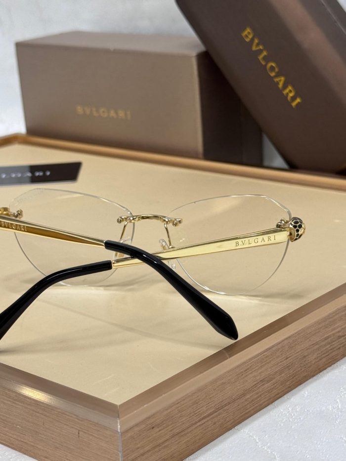 Bvlgari Sunglasses With A  Gold Frame And White Transparent  Gradient Lenses