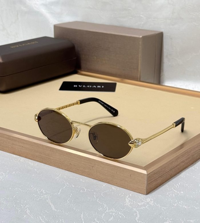 Bvlgari Round Metal Sunglasses With A Gold Frame And Brown Mirror Lenses