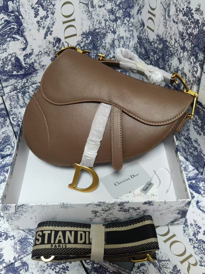Dior Saddle Bag with a strap in warm taupe or tobacco brown grained calfskin leather