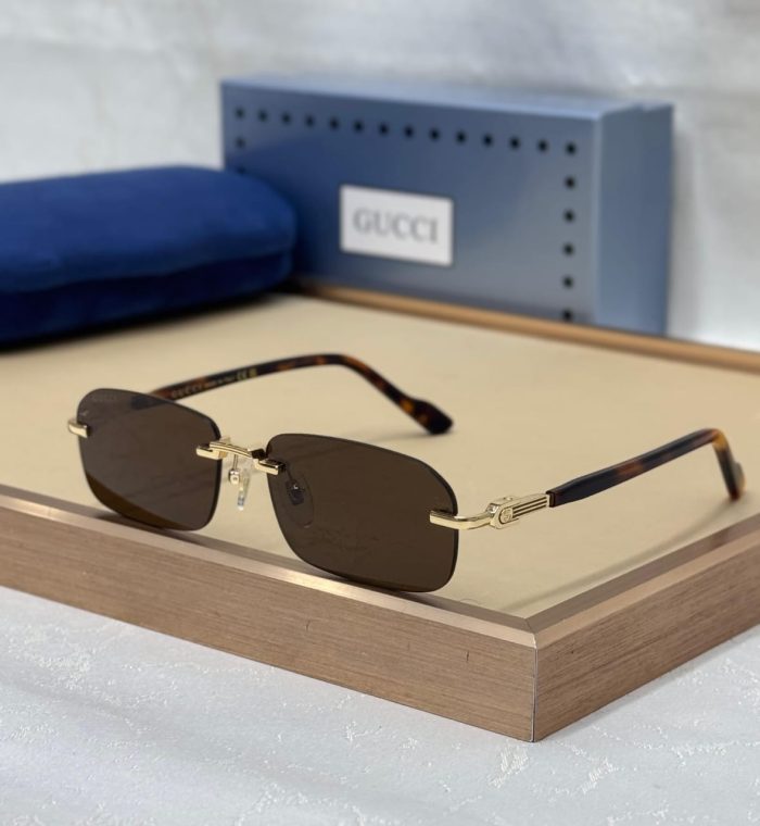 Gucci GG1221S Men's Rimless Sunglasses With Gold Metal Frames and Brown Lenses